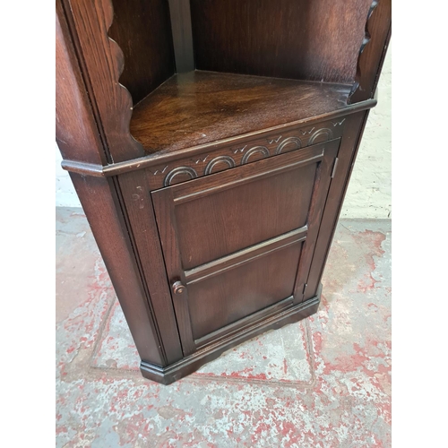 353 - An oak free-standing corner cabinet - approx. 176cm high x 71cm wide x 40cm deep