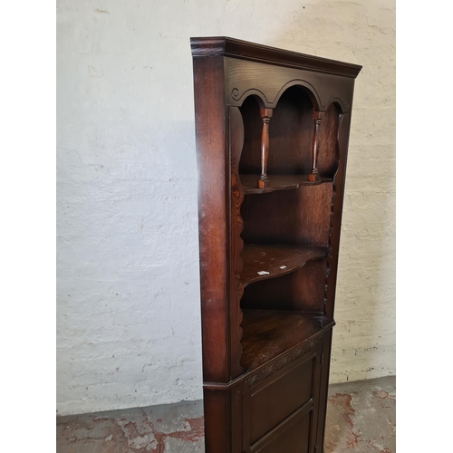 353 - An oak free-standing corner cabinet - approx. 176cm high x 71cm wide x 40cm deep