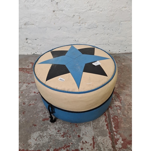 355 - A mid 20th century Rutland blue and white vinyl upholstered circular footstool