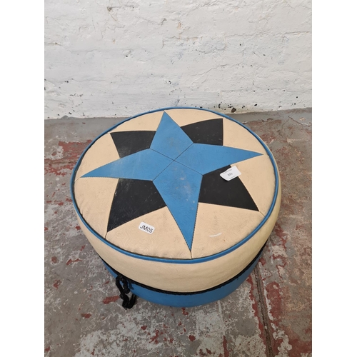 355 - A mid 20th century Rutland blue and white vinyl upholstered circular footstool