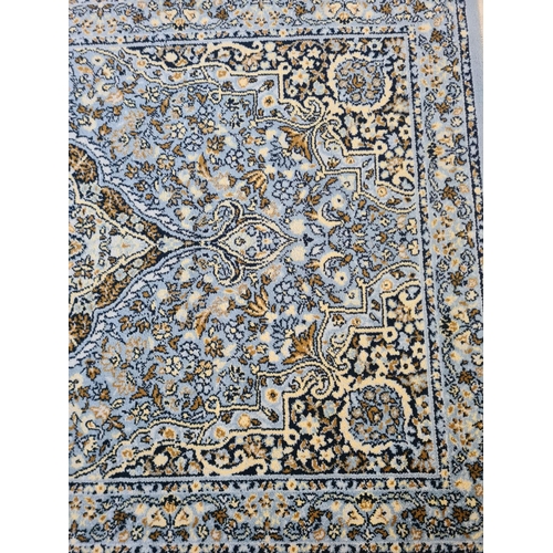 358 - A blue tasselled rug - approx. 175cm x 90cm