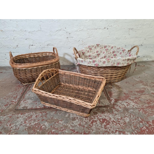 364 - Three wicker twin handled baskets - largest approx. 33cm high x 64cm wide x 50cm deep