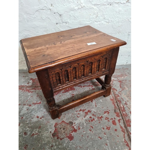 367 - A 17th century style carved oak joint lidded side table - approx. 36cm high x 43cm wide x 31cm deep