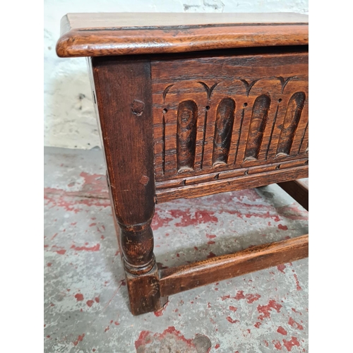 367 - A 17th century style carved oak joint lidded side table - approx. 36cm high x 43cm wide x 31cm deep