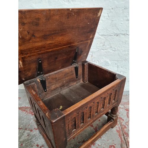 367 - A 17th century style carved oak joint lidded side table - approx. 36cm high x 43cm wide x 31cm deep