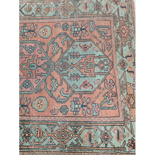 370 - An antique hand knotted rug - approx. 180cm x 105cm