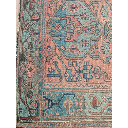 370 - An antique hand knotted rug - approx. 180cm x 105cm