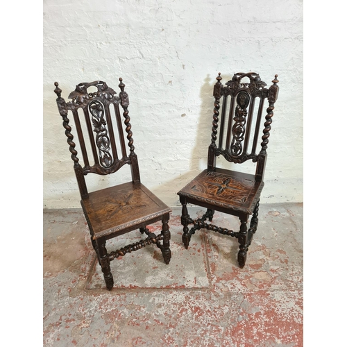 373 - A pair of 19th century heavily carved oak dining chairs with barley twist columns and floral design ... 