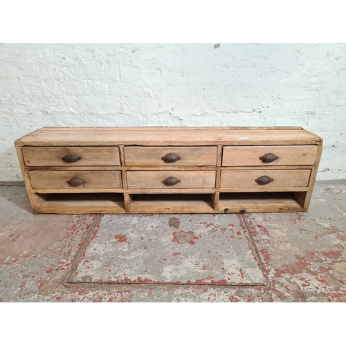 384 - A 19th century pine chest of nine drawers - approx. 39cm high x 140cm wide x 24cm deep