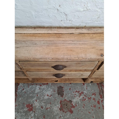 384 - A 19th century pine chest of nine drawers - approx. 39cm high x 140cm wide x 24cm deep