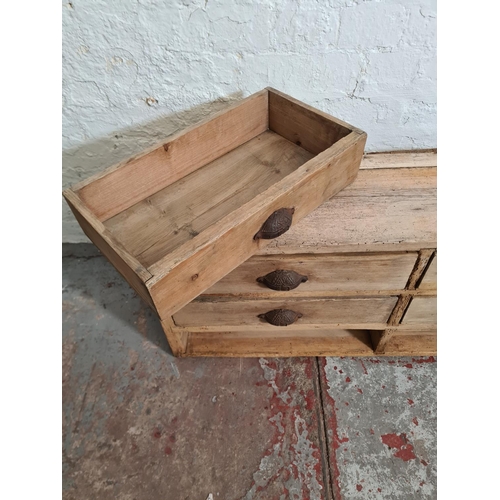 384 - A 19th century pine chest of nine drawers - approx. 39cm high x 140cm wide x 24cm deep