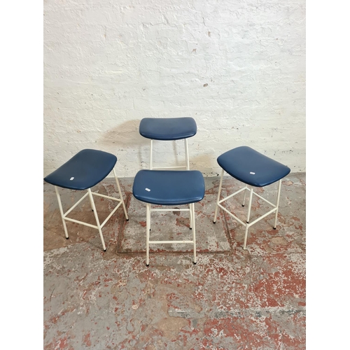 391 - Four 1950s Kandya white tubular metal and blue vinyl stools designed by Frank Guille - three approx.... 