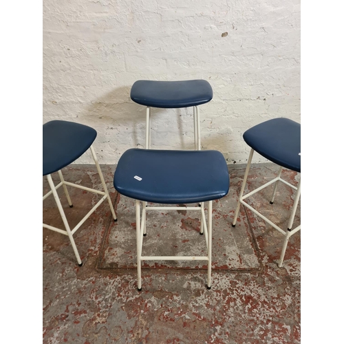 391 - Four 1950s Kandya white tubular metal and blue vinyl stools designed by Frank Guille - three approx.... 