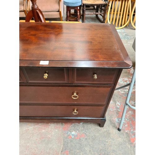 392 - A Stag Minstrel mahogany chest of four short over two long drawers - approx. 71cm high x 107cm wide ... 