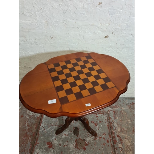 393 - A 19th century style walnut serpentine games table - approx. 71cm high x 70cm wide x 50cm deep