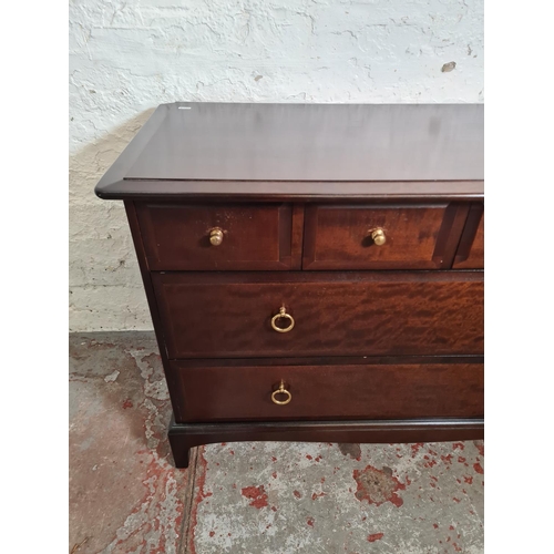 396 - A Stag Minstrel mahogany chest of four short over two long drawers - approx. 71.5cm high x 107cm wid... 