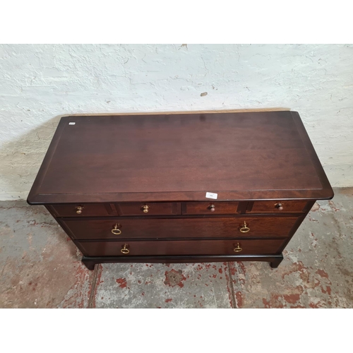 396 - A Stag Minstrel mahogany chest of four short over two long drawers - approx. 71.5cm high x 107cm wid... 