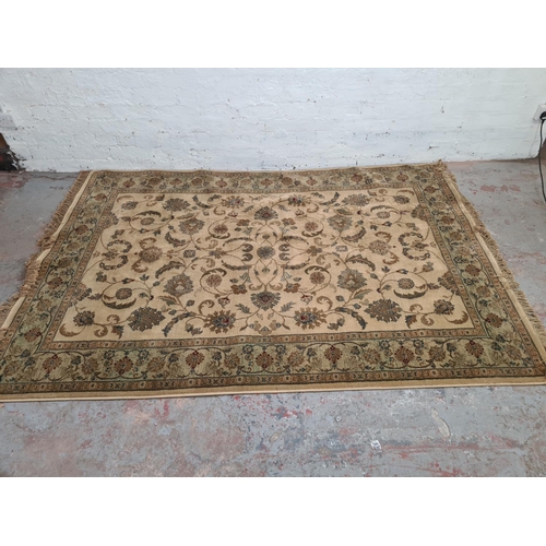 398 - A floral patterned rug - approx. 230cm x 160cm