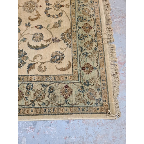 398 - A floral patterned rug - approx. 230cm x 160cm