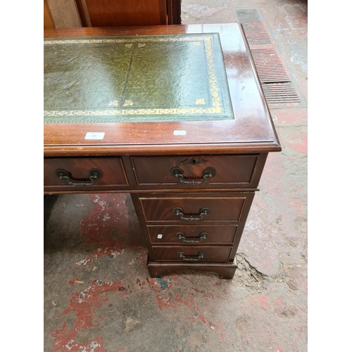 399 - A 19th century style mahogany pedestal desk with eight drawers and green leather writing surface - a... 