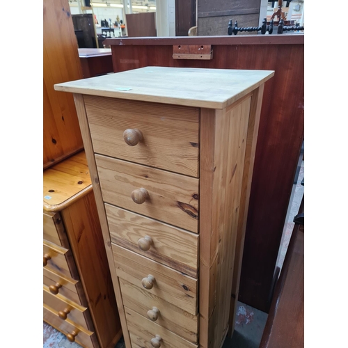 399A - A modern pine chest of seven drawers - approx. 126cm high x 43cm wide x 40cm deep