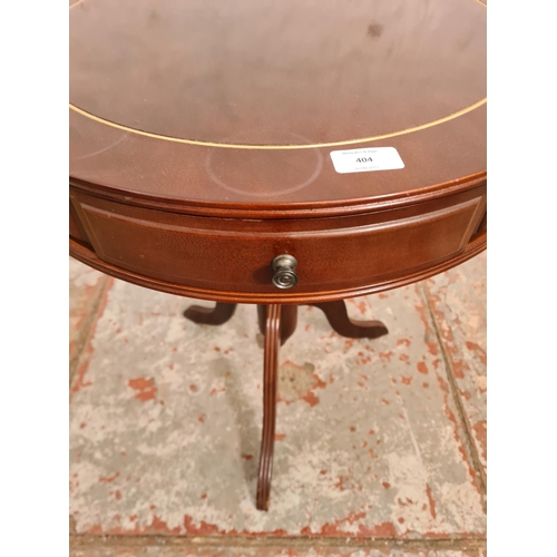 404 - A Regency style mahogany drum table with three drawers - approx. 61cm high x 51cm in diameter