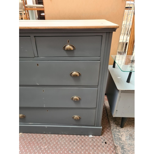 407 - A modern grey painted pine chest of two short over three long drawers with half moon shaped handles ... 