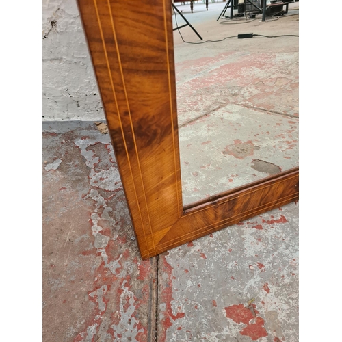 413A - An Edwardian inlaid mahogany wall mirror - approx. 100cm x 68cm