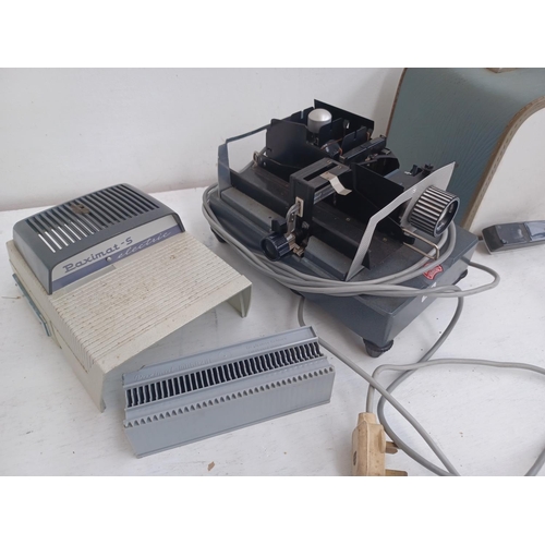 531 - A large quantity of slide equipment and slides to include Braun Paximat-S electric projector, Sawyer... 