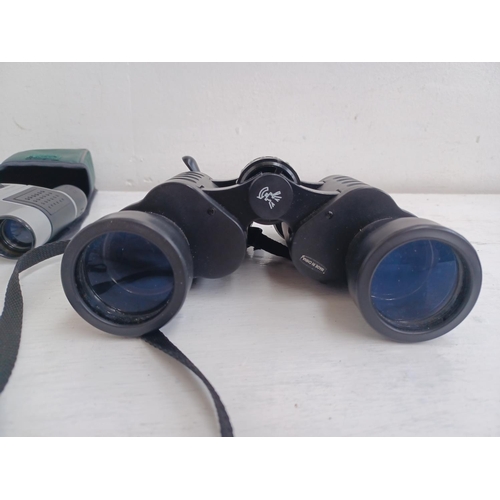 535 - Three cased pairs of binoculars, one Sunagor 8-24x25 Mini Zoom pocket, one National Trust 8x21 pocke... 