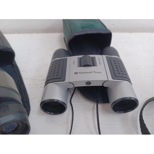 535 - Three cased pairs of binoculars, one Sunagor 8-24x25 Mini Zoom pocket, one National Trust 8x21 pocke... 