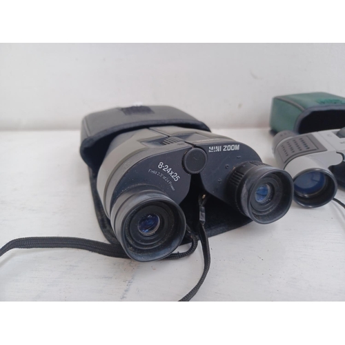 535 - Three cased pairs of binoculars, one Sunagor 8-24x25 Mini Zoom pocket, one National Trust 8x21 pocke... 