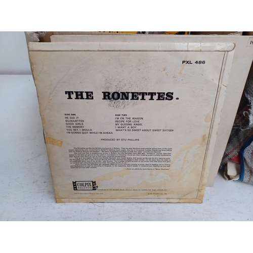 554 - A box and three bags containing vinyl records to include The Ronettes, Queen, The Beatles, Thin Lizz... 