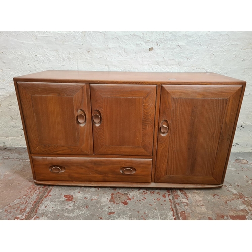 301A - An Ercol Windsor elm sideboard - approx. 64cm high x 104cm wide x 44cm deep