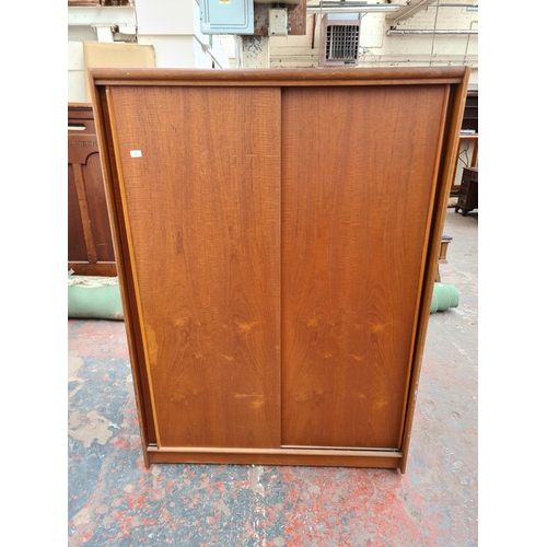 305 - An Austinsuite teak double wardrobe - approx. 70cm high x 121cm wide x 65cm deep