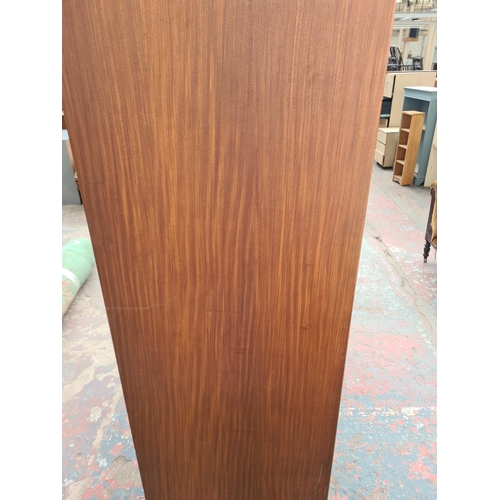 305 - An Austinsuite teak double wardrobe - approx. 70cm high x 121cm wide x 65cm deep