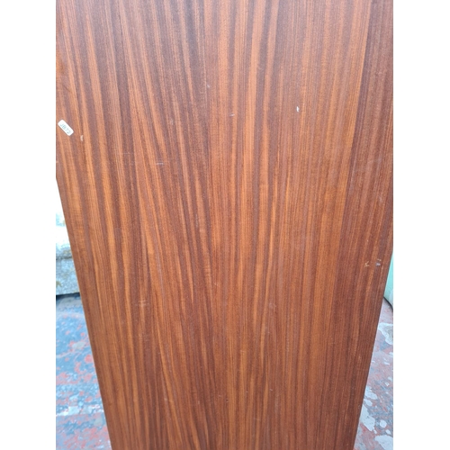 305 - An Austinsuite teak double wardrobe - approx. 70cm high x 121cm wide x 65cm deep