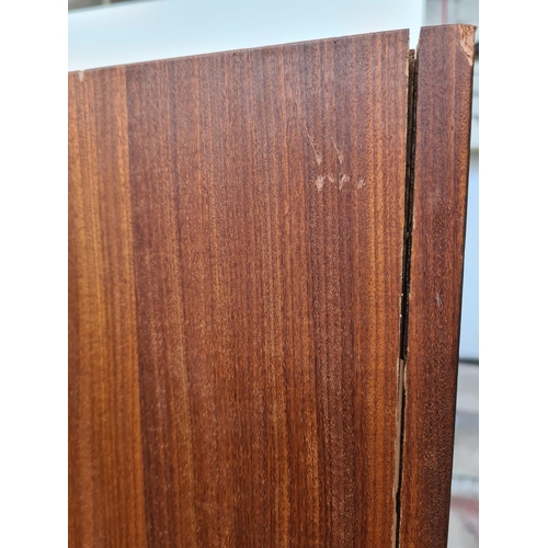 305 - An Austinsuite teak double wardrobe - approx. 70cm high x 121cm wide x 65cm deep