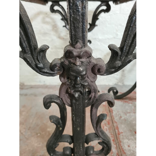 306 - Three black painted iron table bases, two Victorian cast - approx. 69cm high x 42cm wide x 70cm long... 