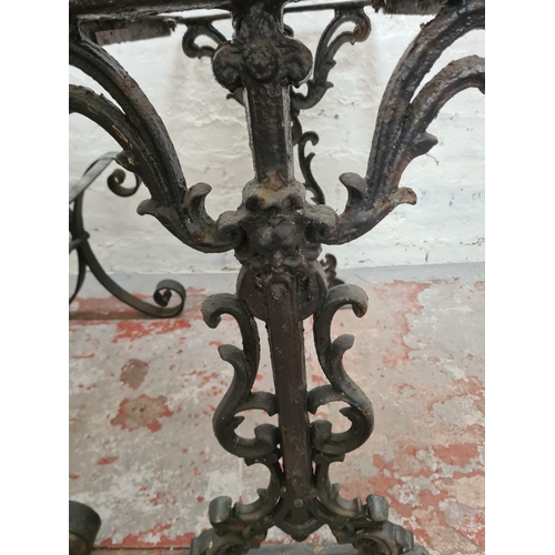 306 - Three black painted iron table bases, two Victorian cast - approx. 69cm high x 42cm wide x 70cm long... 