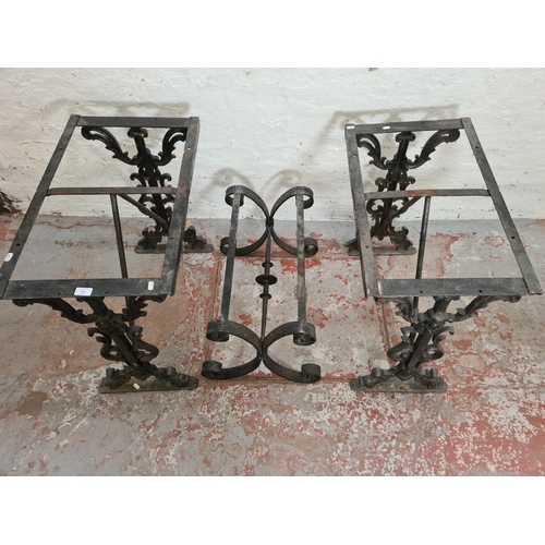 306 - Three black painted iron table bases, two Victorian cast - approx. 69cm high x 42cm wide x 70cm long... 