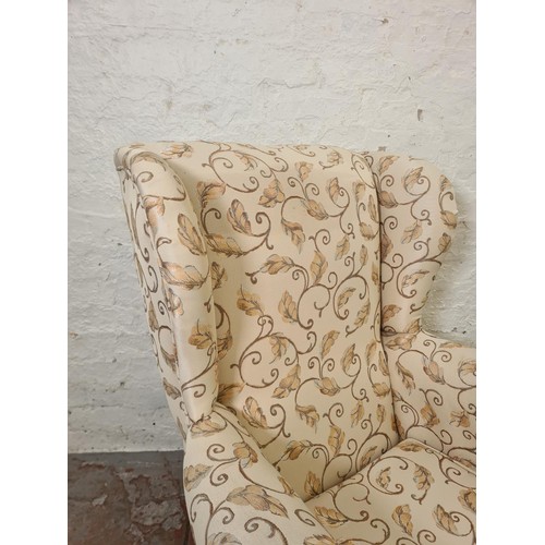 292 - A Plumbs floral upholstered wing back armchair with cabriole supports - approx. 102cm high x 77cm wi... 