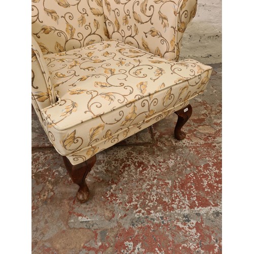 292 - A Plumbs floral upholstered wing back armchair with cabriole supports - approx. 102cm high x 77cm wi... 