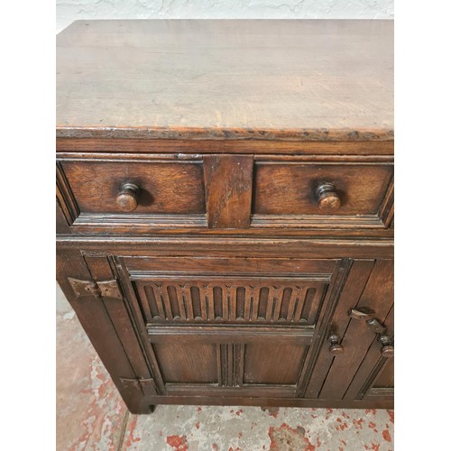 291 - A mid/late 20th century oak sideboard with two drawers and two cupboard doors - approx. 84cm high x ... 