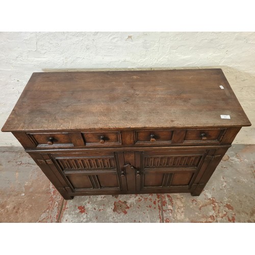 291 - A mid/late 20th century oak sideboard with two drawers and two cupboard doors - approx. 84cm high x ... 