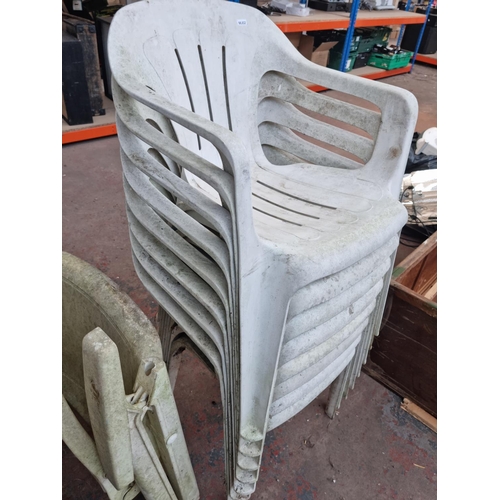 728 - A large collection of plastic garden chairs