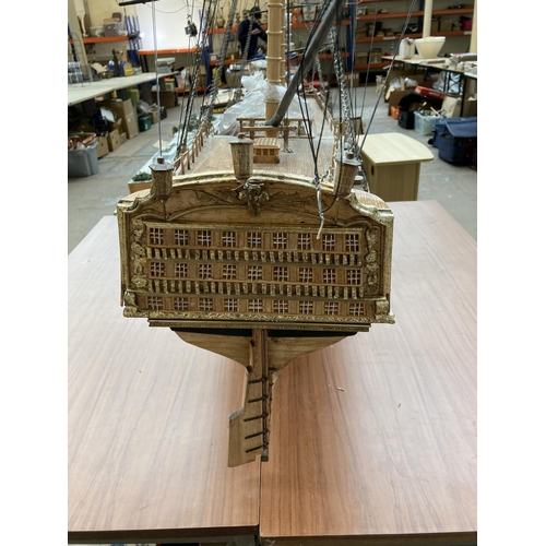 105A - A large scratch built wooden three mast model of The Victory ship on plinth - approx. 150cm high x 2... 
