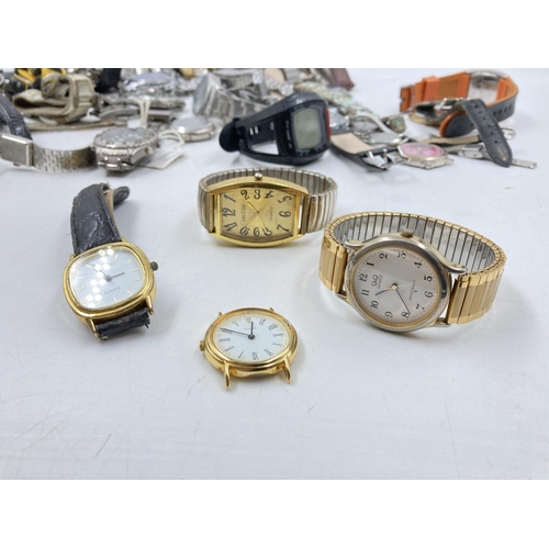 110 - A large collection of assorted wristwatches to include Accurist, Ben Sherman, Citron, Timex etc.