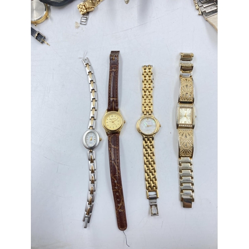 112 - A large collection of assorted wristwatches to include Sekonda, Gucci, Seiko etc.