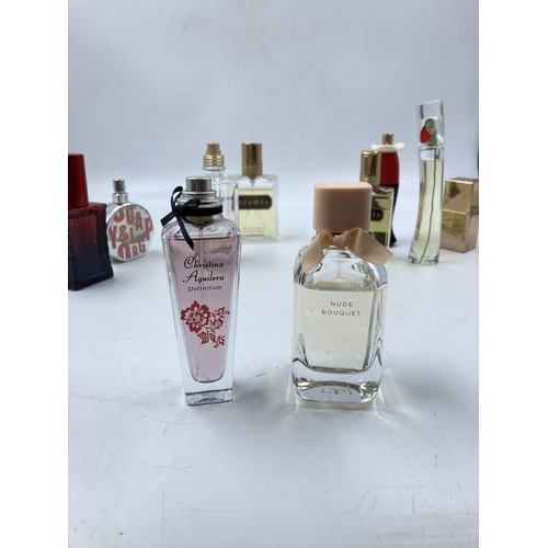 115 - A collection of assorted women's perfume to include Michael Kors Sexy Ruby, Michael Kors Rose Radian... 